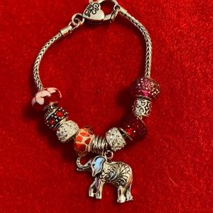 Read and white charm bracelet.